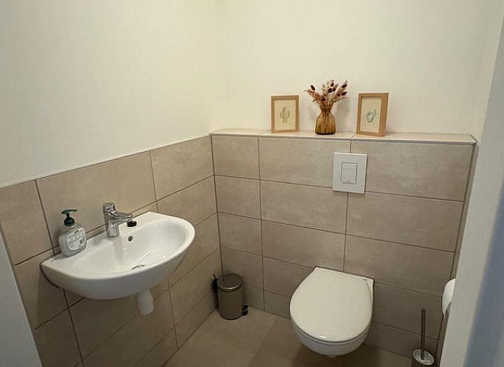 Attractive bedroom in Holiday cottage in Schildwolde, northeastern Groningen, with comfortable bed and country mural.