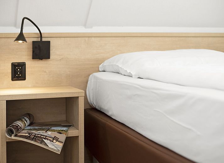 Stylish living room with fireplace in Natuurdorp Suyderoogh 4-bed bungalow, Lauwersoog.