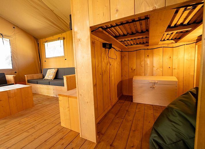 Modern bathroom in Safari Tent 8, a glamping lodge in Vierhuizen, Northwest Groningen, with wooden interior and luxury amenities.