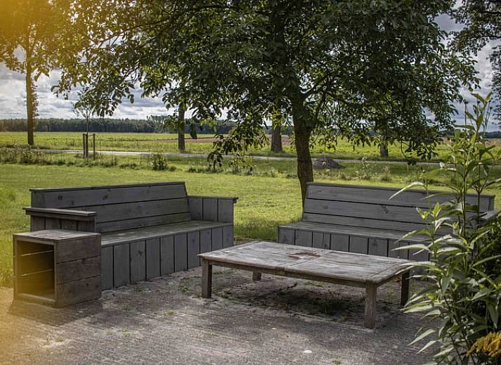 Gemuetliche Leseecke im Ferienhaus in Bourtange, perfekt fuer Entspannung in Groningen.