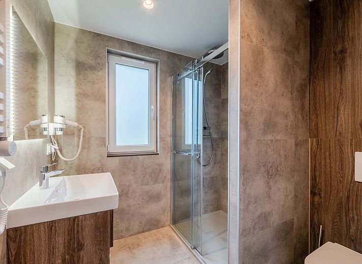 Binnenruimte van vakantiehuis in Sellingen, Zuidoost Groningen met comfortabele zithoek.