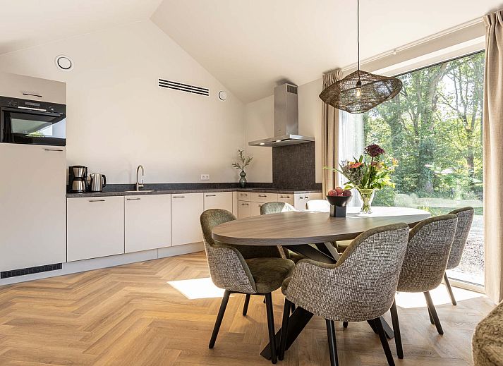 Enjoy the sun on the spacious terrace of the detached house in Sellingen, Southeast Groningen, ideal for a relaxing vacation.