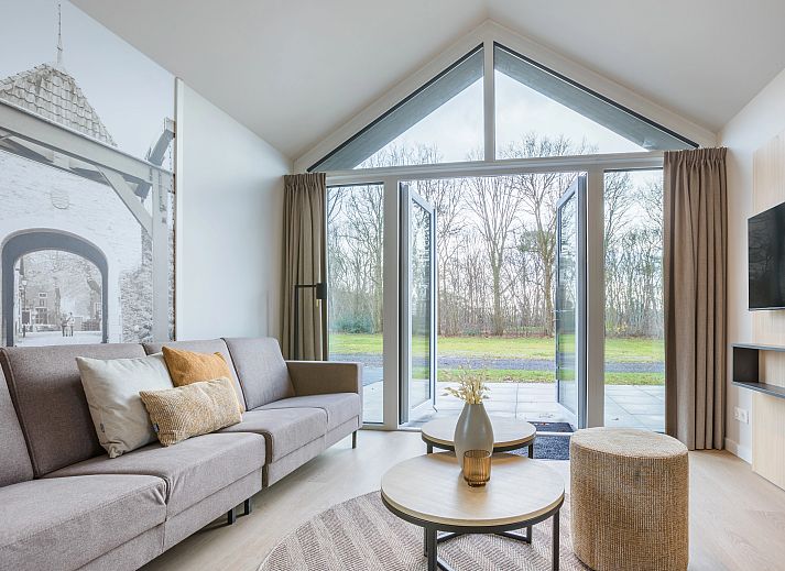 Bright living room of vacation home 4-person house 4C in Sellingen, overlooking nature.