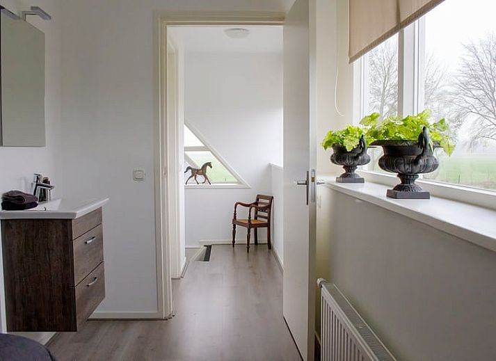 Gezellige slaapkamer in Huisje in Marum, vakantiehuis in Zuidwest Groningen met knusse sfeer.