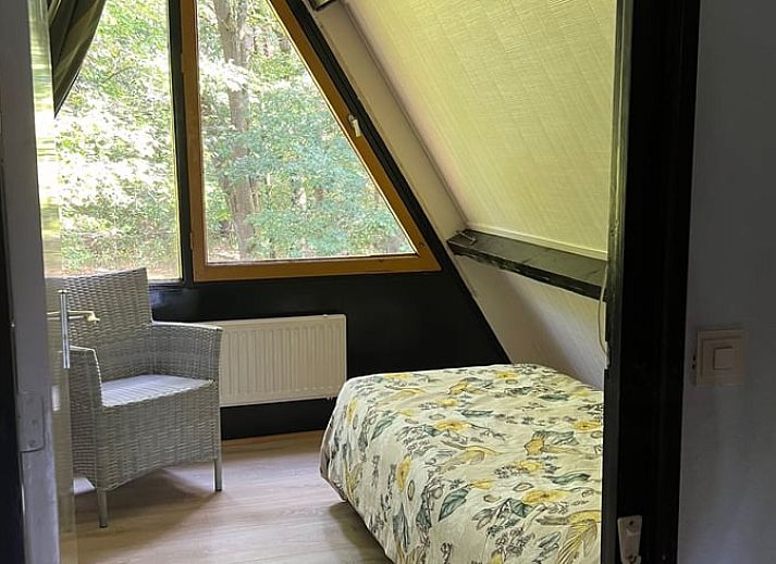 Cozy living room in Holiday home in Stramproy, Limburg with access to terrace.