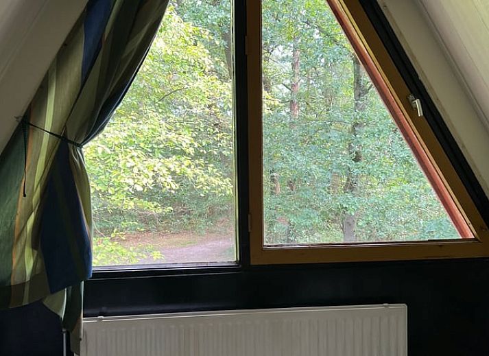 Cozy living room in Holiday home in Stramproy, Limburg with access to terrace.