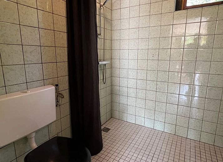 Cozy living room in Holiday home in Stramproy, Limburg with access to terrace.