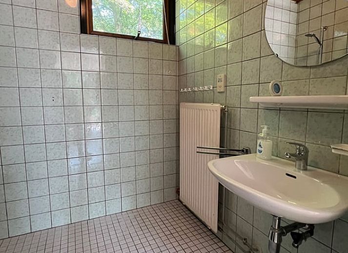 Cozy living room in Holiday home in Stramproy, Limburg with access to terrace.