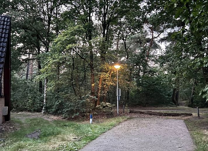 Indoor area of Holiday Home in Stramproy, Limburg overlooking green garden.