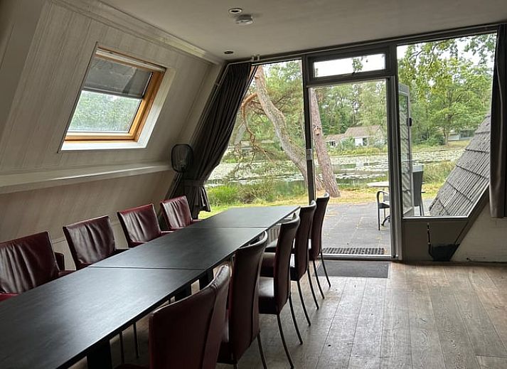 Stylish living room of Holiday Home in Stramproy, Central Limburg, with modern furnishings and comfortable seating area for relaxation.