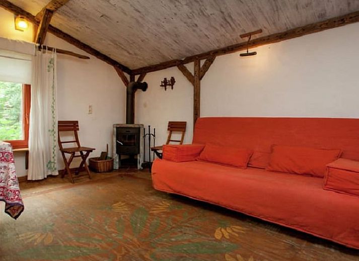 Huisje in Leudal, een rustiek vakantiehuis in Midden Limburg, omringd door weelderige natuur en een serene tuin.