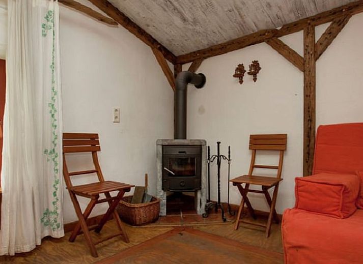 Huisje in Leudal, een rustiek vakantiehuis in Midden Limburg, omringd door weelderige natuur en een serene tuin.