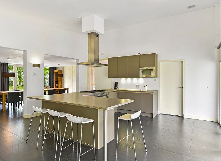 Modern living room in Landgoed Aerwinkel's 10-bed bungalow, Posterholt, Limburg.