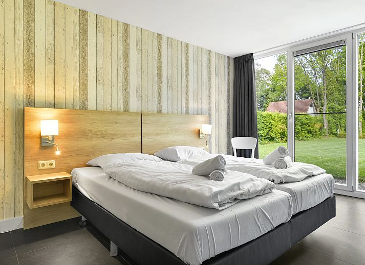 Modern living room in Landgoed Aerwinkel's 10-bed bungalow, Posterholt, Limburg.