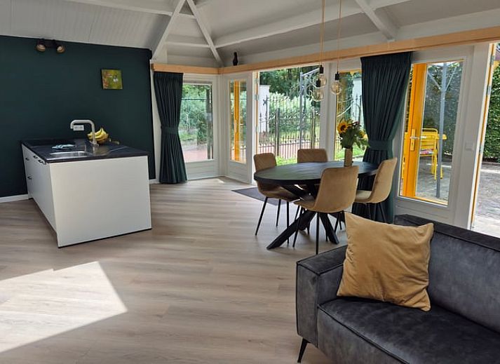 Modern kitchen in Holiday Home in Nederweert-Eind, Central Limburg overlooking sunny terrace and garden, ideal for a relaxing stay.