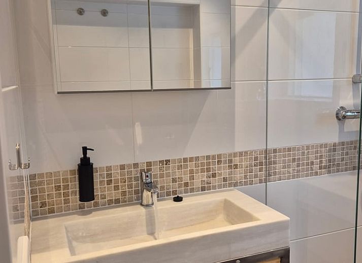 Modern kitchen in Holiday Home in Nederweert-Eind, Central Limburg overlooking sunny terrace and garden, ideal for a relaxing stay.