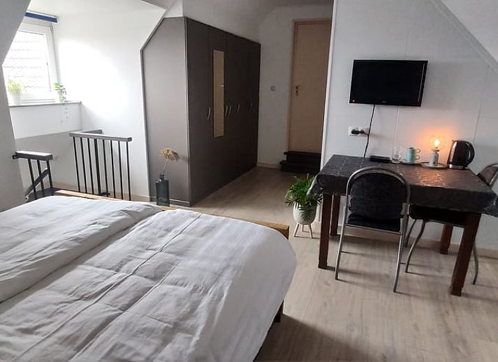 Geniessen Sie den gruenen Garten von Huisje in Kelpen-Oler, einem Ferienhaus in Mittellimburg, mit schoener Aussicht auf die Natur.