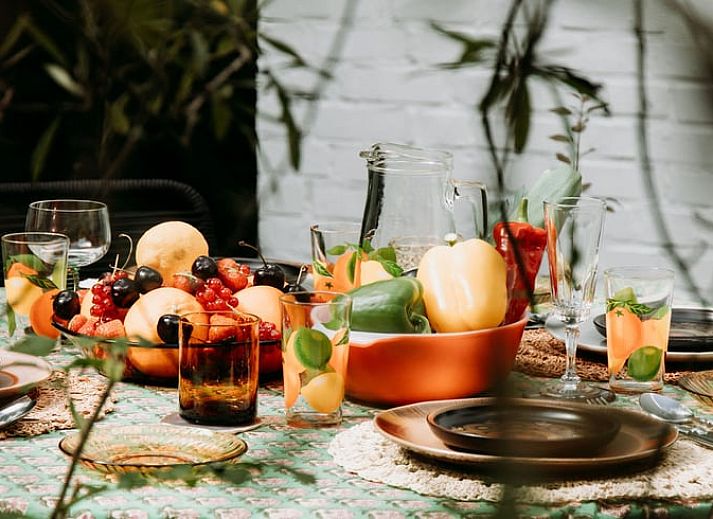 Cozy living room in Holiday Home in Haelen, Central Limburg, overlooking the green surroundings.