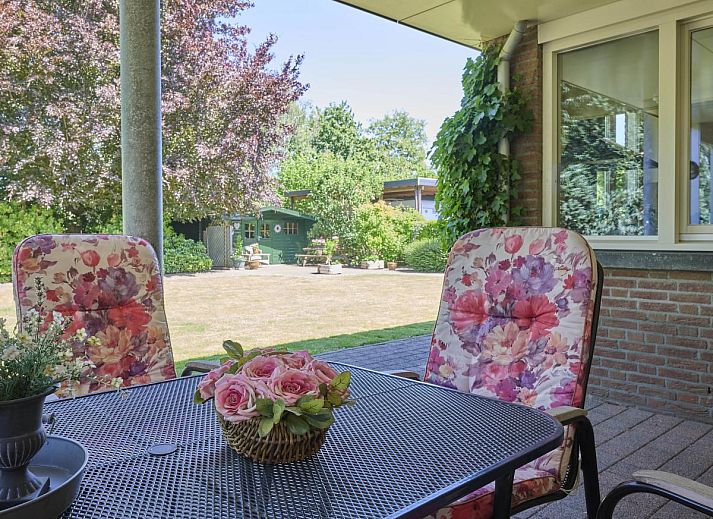 Cozy living room of Lionshuis vacation home in Panningen, Limburg with comfortable seating.