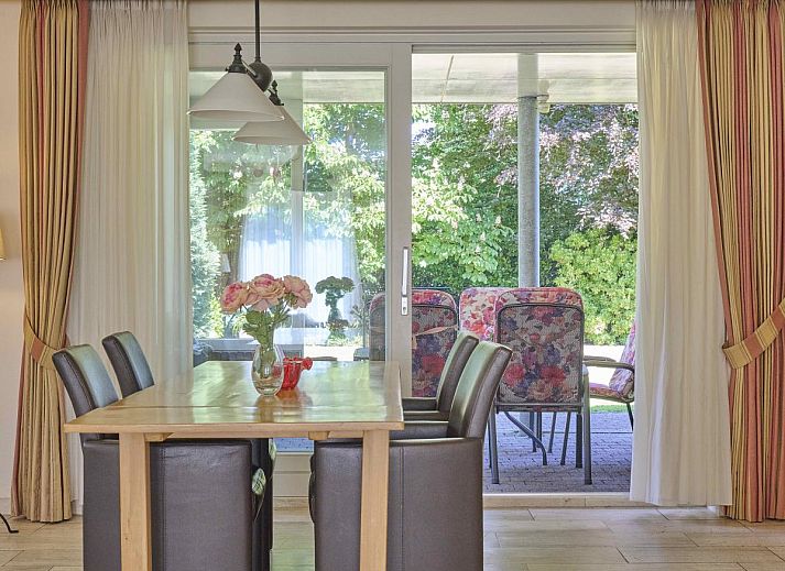 Cozy living room of Lionshuis vacation home in Panningen, Limburg with comfortable seating.