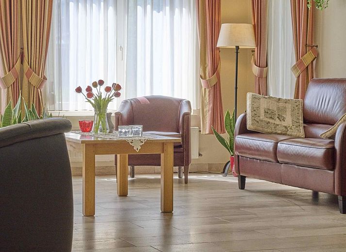 Bright sitting area in Lionshuis vacation home in Panningen, Limburg with modern appliances.