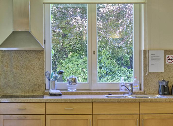 Bright sitting area in Lionshuis vacation home in Panningen, Limburg with modern appliances.