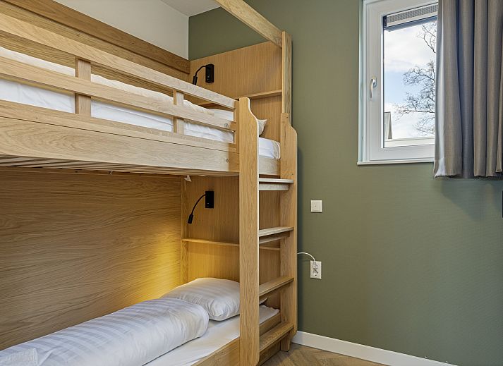 Exterior of the 12-person wellness villa 12ELW in Well, North Limburg, surrounded by nature.