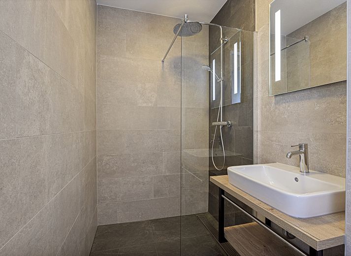 Sunny living room with a view in the 12-person wellness villa 12ELW in Well, North Limburg.