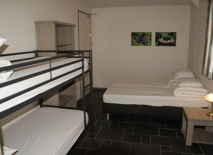 Bedroom in L006 vacation home, Arcen, Limburg with comfortable double bed.