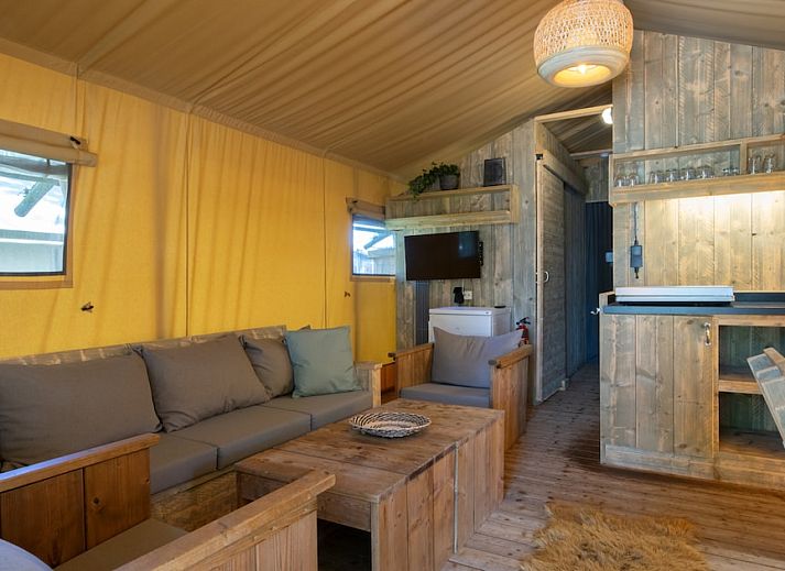 Enjoy peace and quiet in Safari Tent 6A, a luxury safari tent in Arcen, North Limburg, with an inviting veranda and green surroundings.