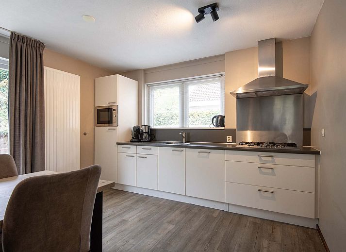 Vrijstaande woning in Arcen, Noord Limburg, biedt een charmant vakantiehuis met ruime binnenruimte en groene omgeving.