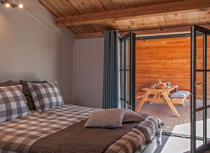 Speelruimte met schommel bij Huisje in Afferden, Noord Limburg, vakantiehuis in groene omgeving.