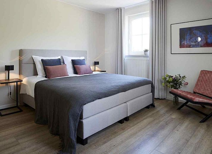 Cozy living room in vacation home L185 in Baarlo, North Limburg with comfortable seating area and modern furnishings.