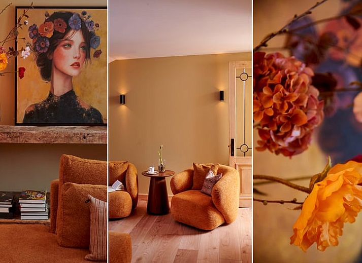 Gemuetliches Wohnzimmer im Ferienhaus in Baarlo, Nord-Limburg. Gemuetliche Sitzecke mit warmer Beleuchtung und modernen Moebeln.