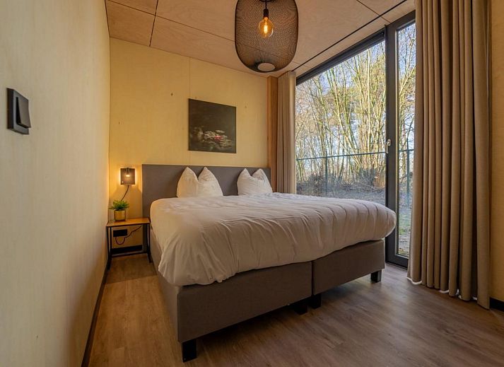 Stylish interior of Bos Villa in Maasbree, North Limburg. Luxury vacation home for 8 with modern furnishings and spacious dining area.