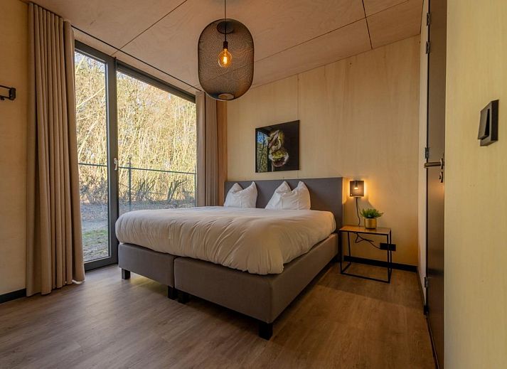 Stylish interior of Bos Villa in Maasbree, North Limburg. Luxury vacation home for 8 with modern furnishings and spacious dining area.