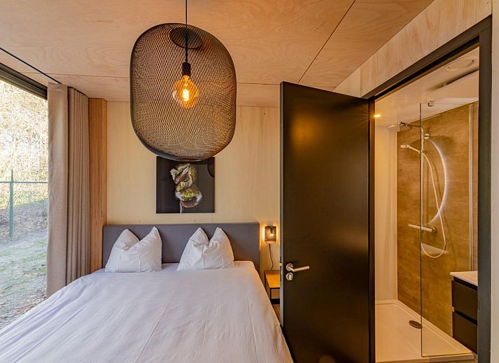 Enjoy the serene nature surrounding Bos Villa, a vacation home for 8 in Maasbree, Limburg, with spacious terrace and modern furnishings.