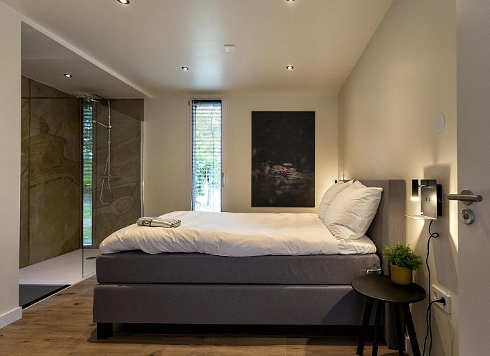 Gezellige veranda bij Bos Cottage in Maasbree, Noord Limburg, perfect voor families in dit vakantiehuis voor 6 personen.