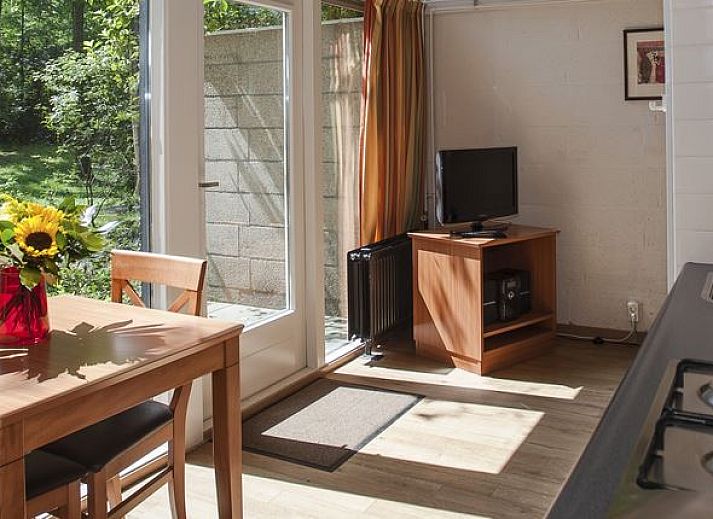 Bright interior of De Lommerbergen 2-bed bungalow in Reuver, North Limburg with comfortable seating area.