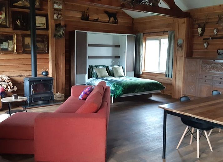 Dining Room in Holiday Home in Sevenum, North Limburg, with wooden table and bar.