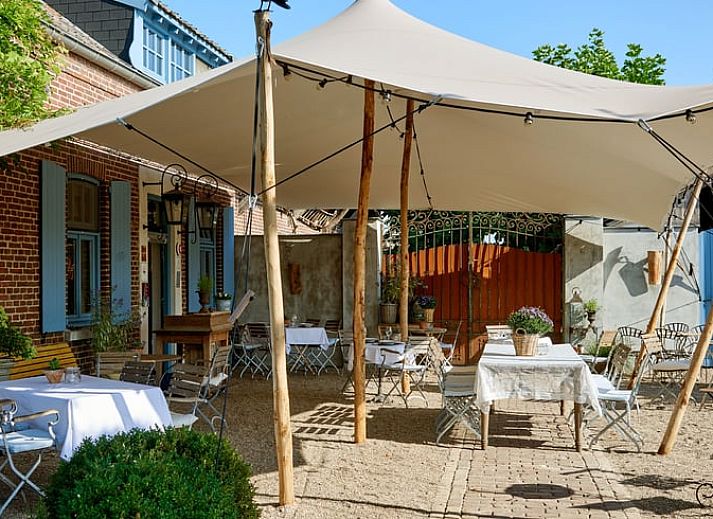 Knusse zithoek met open haard in Huisje in Sevenum, vakantiehuis in Limburg.