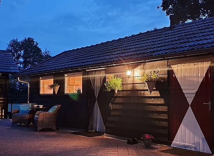 Cozy terrace at Holiday home in Heythuysen, North Limburg, with comfortable chairs and nature surrounding the vacation home.