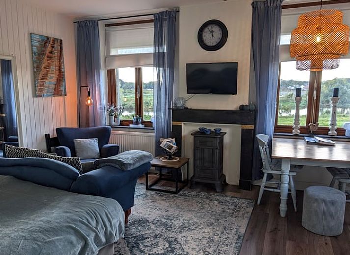 Cozy indoor area of Holiday Home in Maastricht, South Limburg, with comfortable sitting area and dining area.