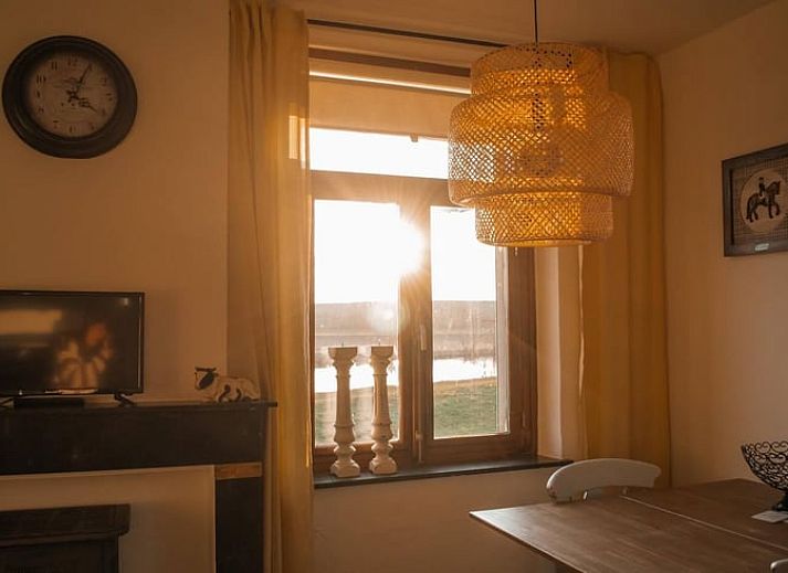 Cozy indoor area of Holiday Home in Maastricht, South Limburg, with comfortable sitting area and dining area.