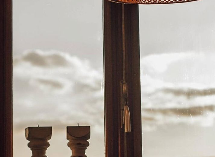 Cozy indoor area of Holiday Home in Maastricht, South Limburg, with comfortable sitting area and dining area.