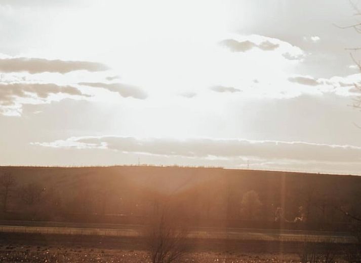 Cozy indoor area of Holiday Home in Maastricht, South Limburg, with comfortable sitting area and dining area.