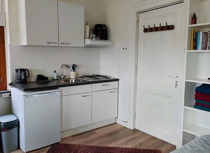 Cozy living room in Holiday home in Maastricht, South Limburg, overlooking the green surroundings.