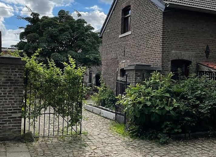 Warm evening sun illuminates the dining area in Holiday Home in Maastricht, South Limburg, with stylish decoration.