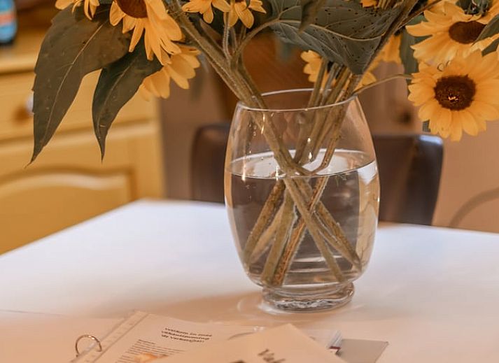 Cozy living room of Holiday Home in Maastricht, South Limburg with comfortable sofas and wooden staircase.