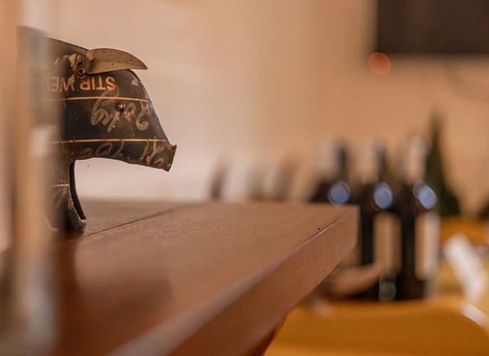Nice reading corner in Holiday Home in Maastricht, South Limburg with books and a comfortable chair.